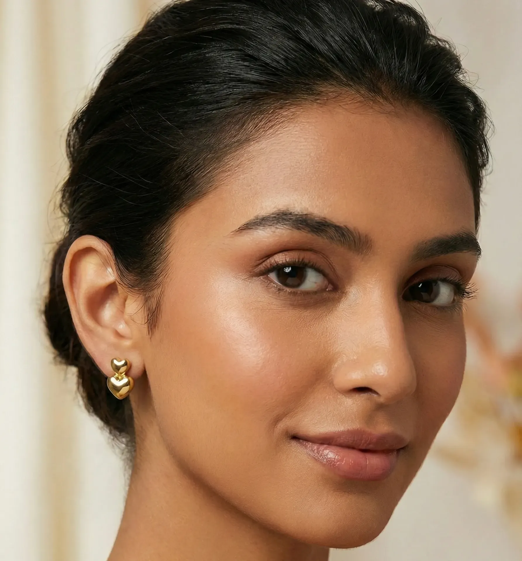 The Gilded Double Heart Studs